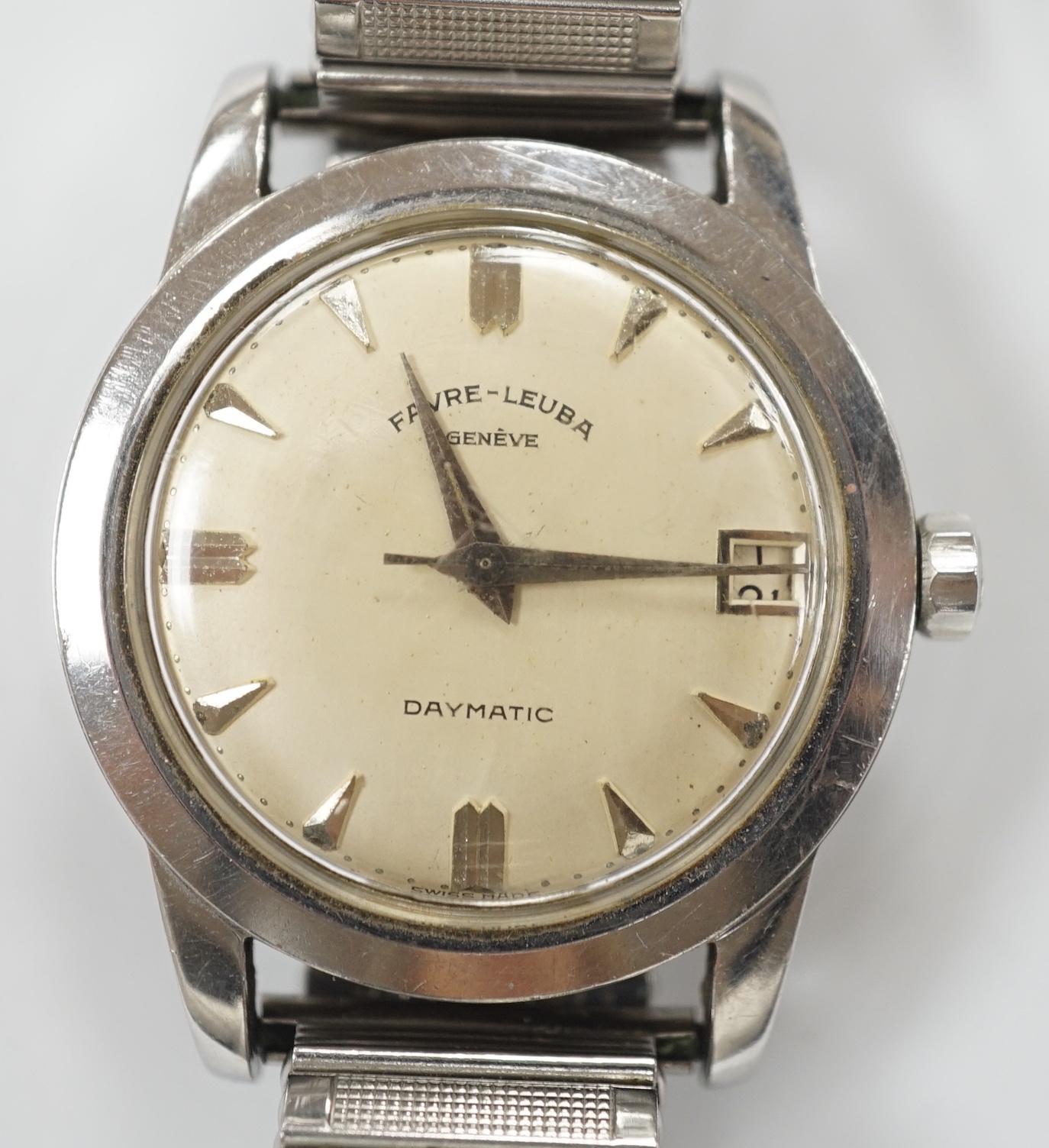 A gentleman's stainless steel Favre Leuba Daymatic manual wind wrist watch, on associated flexible strap.